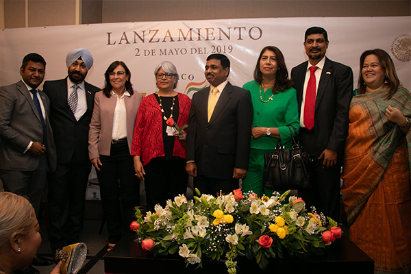 Inder Pal Singh engaging with participants during a networking session at a business event.